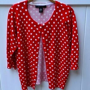 Red and white polka dot cardigan sweater.